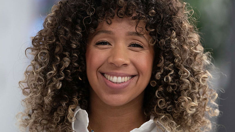 Ashley smiling at the camera.