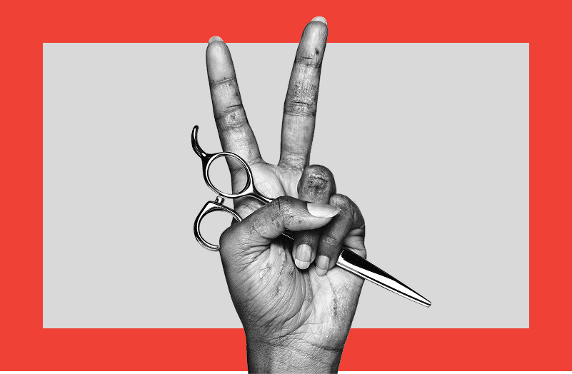 Black and white photograph of a hand with moderate to severe hand eczema making a 'peace' gesture while holding a pair of hairdressing scissors.
