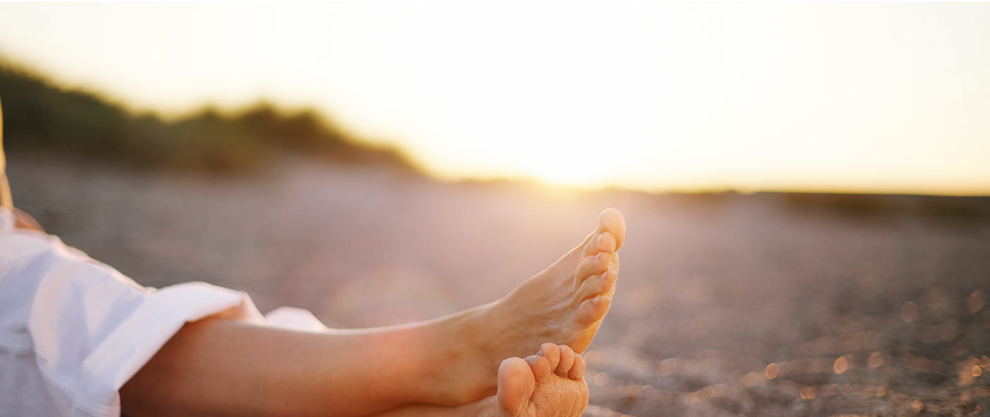 Benen op het strand