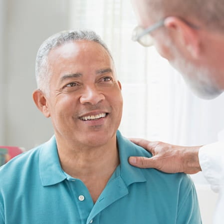 Dermatologist speaking with eczema patient