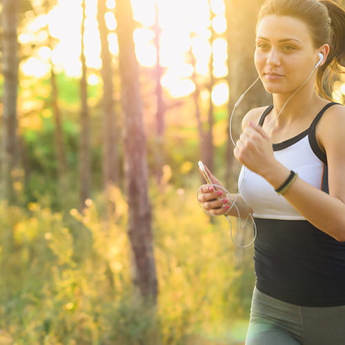 Woman running in the woods