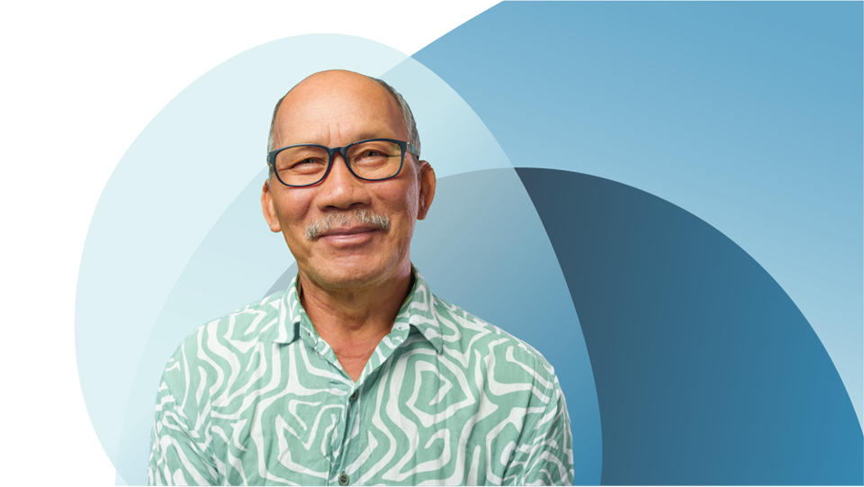 Smiling man in patterned shirt