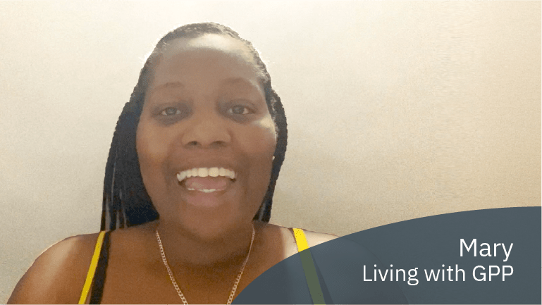 Mary, living with GPP, smiling in a video about overcoming challenges